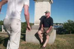 Dana instructs me in the game of hopscotch in the local graveyard