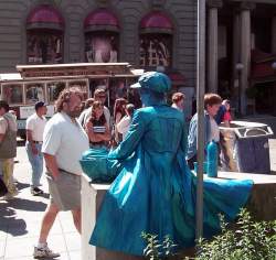 This blue woman just sits there for hours like a statue