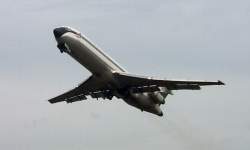 Watching planes take off from a park next to the airport