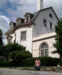 Zambia has a lovely building, but a parking lot full of early 80s Buicks