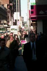 The morning rush to work of grey faces and black suits