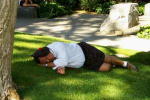 Guy wearing a kilt, asleep in the park. I think he was supposed to be participating
in the wedding, but the heat got the better of him.