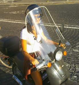 Smart girl on a moped.