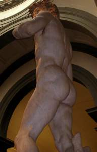 Looking up at him from behind