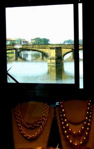 A view of the Arno through a gold shop on the famous bridge - Ponte Vecchio