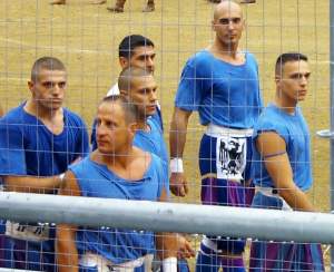 Members of the sexy blue team. Those tshirts wouldn't stay on long once they started wrestling each other to the ground!