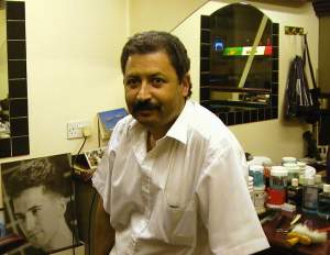 Ali the Barber, where I got my hair cut this afternoon. He was recommended by David and Kelvin yesterday. He's worked in the same small
barbershop inside a billiards-hall in Leicester Square for over twenty years.