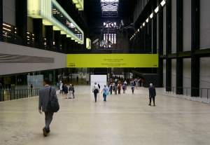 Descending the ramp into the Turbine Hall. Notice the glowing boxes clamped high up the wall.
Some of these turn out to be intimate little reading rooms.