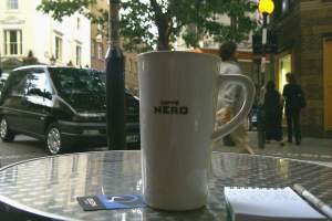 At Caffe Nero with my coffee and notebook.