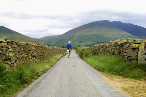 Alone on a silent lane, in the middle of a plain surrounded by the mountains.
