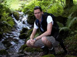 The stream that comes tumbling through the woods.