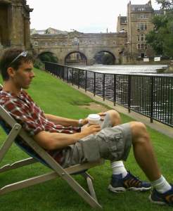 Relaxing in a deck-chair in the Parade Gardens. In the background is the Pultney Bridge,
a residential bridge that gives rise to the second comparison with Florence.