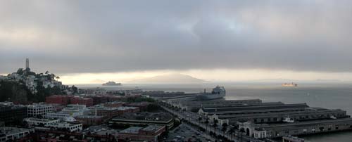 Dusk on a foggy evening from my balcony. To the right, a lone freighter passes through the
one lingering shaft of sunlight.