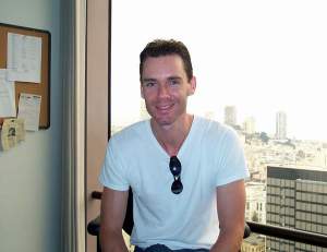 On Saturday afternoon, I gave them a shopping tour of downtown, then left them
to their own devices. We stopped by my office to see the view, and Kirstie insisted
on taking a photo of me in my office to show my parents.
