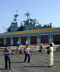 More ship photos. (Sorry :) The top-hamper of an aircraft carrier whose
hull is hidden behind a wharf.