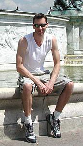 Me on the edges of the fountain across from the palace.