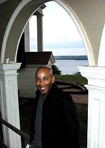 Shaun next to the house, with the Potomac in the background.