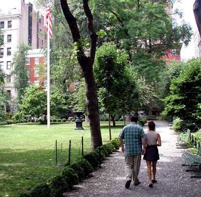 Mitch and his friend Vicky walking in Gramercy Square Park.