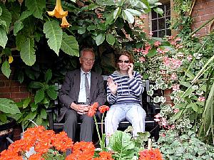 Kirstie and Dad surrounded by flowers in Westcott House