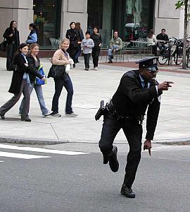 A traffic cop entertains both drivers and pedestrians with his fabulous street theater, at Penn.