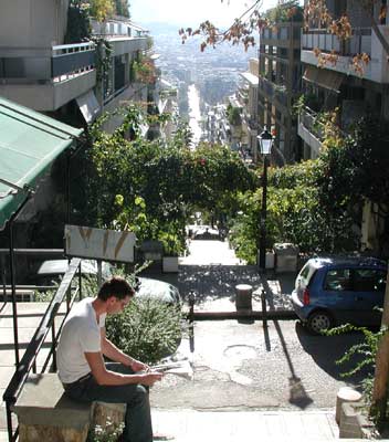 Passing time with the International Herald Tribune while waiting for the furnicular.