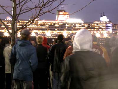 The many onlookers on the pier ogling the biggest passenger ship ever built