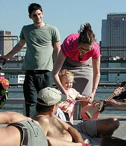 A family mingling with a group of gay guys 