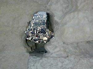 A shot of Athens through an ancient hole in the wall of part of the Acropolis