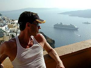 At a cafe, looking down on the ship and the calderra