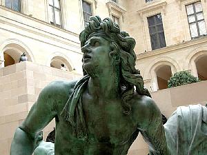 Part of a huge statue in the quartet of figures from the Place des Victoires, in the Louvre